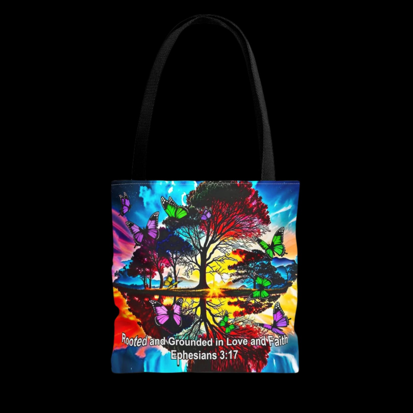 Tote bag with a colorful design of a tree and butterflies on a white background